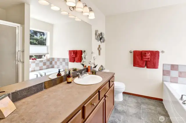 Enjoy a luxurious 5-piece bath—featuring a soaking tub, large vanity and a separate shower.