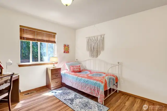 Bedroom 2 overlooks the back yard as well.