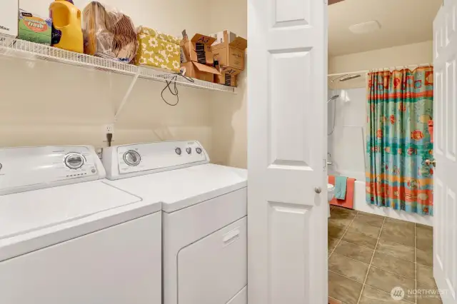 The laundry space is in the hallway towards the main bath.