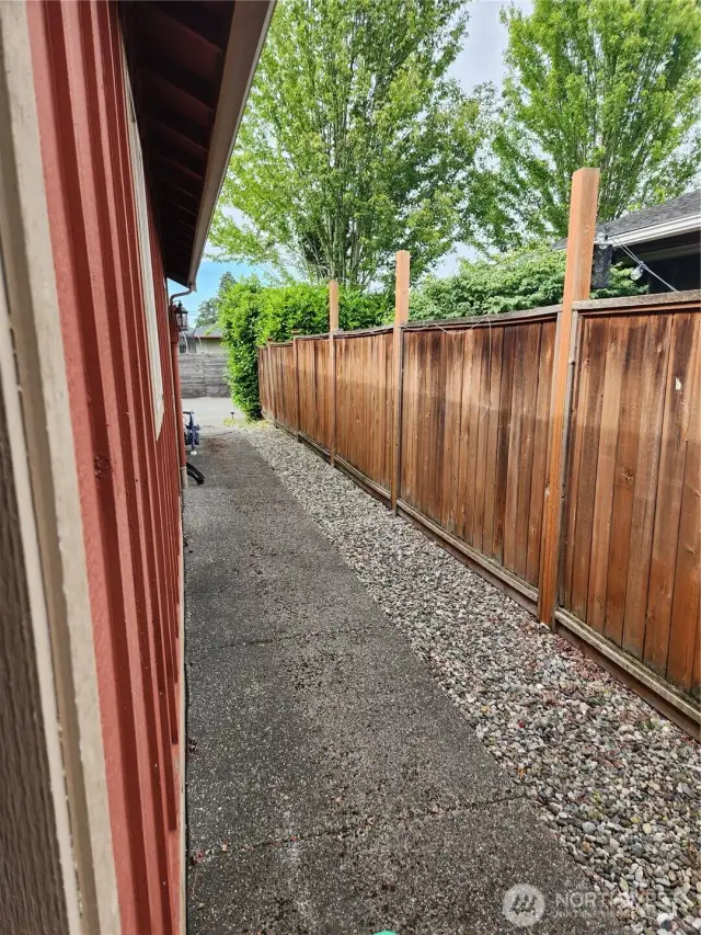 Walk way to front yard along the garage.