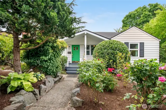 Adorable curb appeal with beautiful mature landscaping.