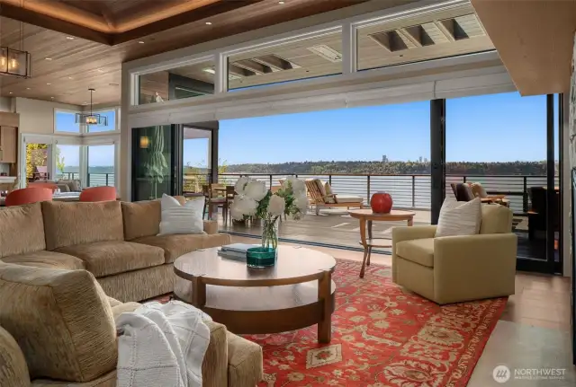Wall of windows/sliders opening to heated, covered entertaining spaces.