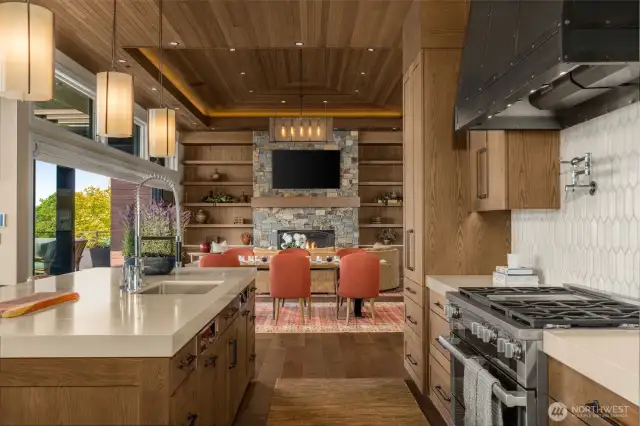 Custom hammered steel hood is the anchor point of the spacious kitchen.