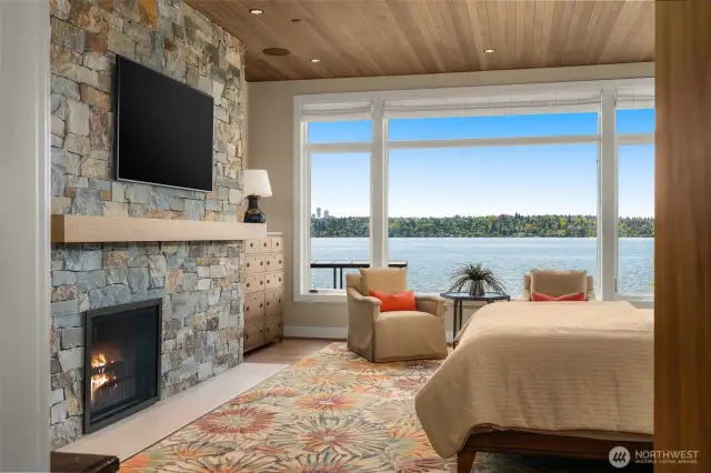 Primary en-suite. One of three indoor and two outdoor fireplaces.