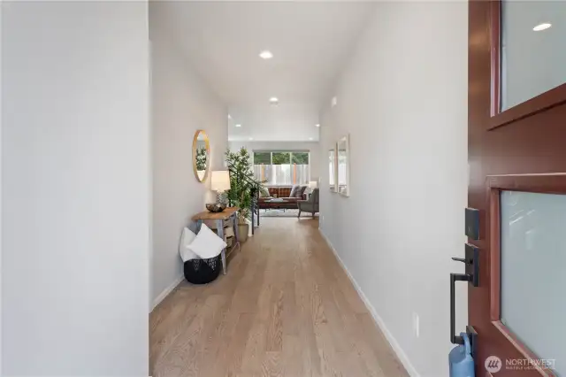Step inside to a welcoming foyer with gleaming LVP flooring that glides you to the main living spaces.