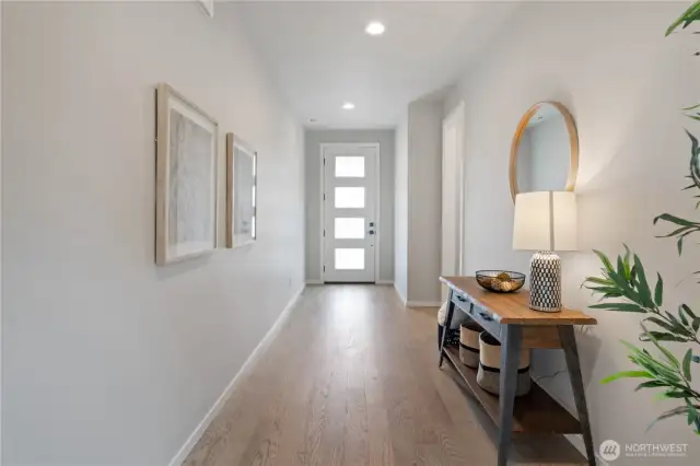 To the right of the entryway is the main floor powder room and a discreetly tucked away roomy storage closet.