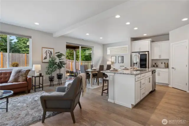 Adjacent to the living room is the chef's dream kitchen and dining area.