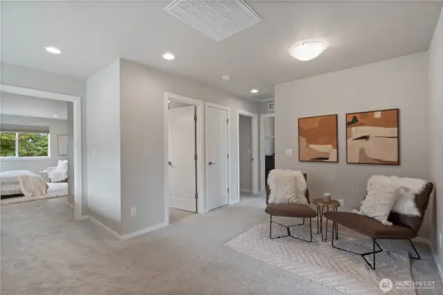 At the top of the upstairs landing is this bonus loft area, offering much versatile use: a dedicated home office space, reading nook or a relaxing entertainment center.