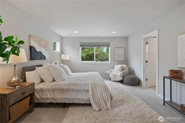 Escape to your primary suite, a sanctuary of relaxation, at the end of the day. Primary suite overlooks a peaceful lush greenbelt behind the home.