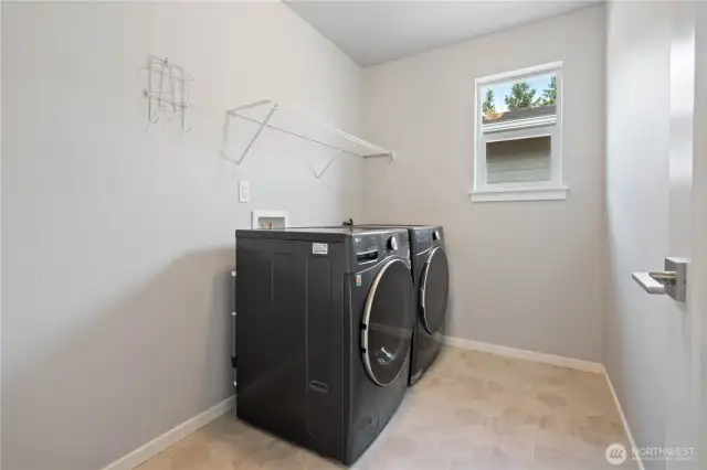 Spacious utility room with full-size Washer/Dryer set that stays.