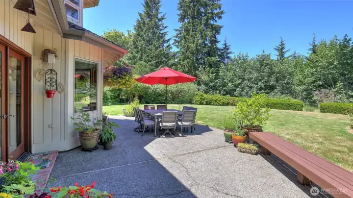 Step outside to beautifully landscaped surroundings and a versatile outdoor living area. Over-sized patio and wrap-around deck extends full length of the home.