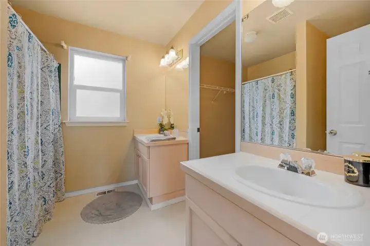 2 separate sinks with the walk in closet in between.