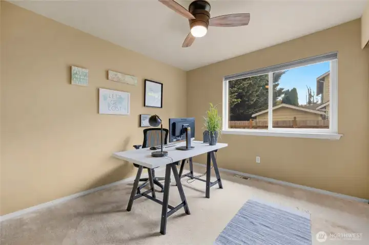 2nd freshly painted bedroom being used as an office.
