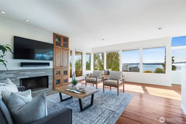 Generous living room with almost floor to ceiling windows
