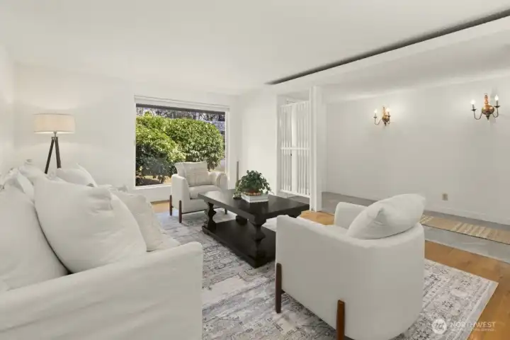 Large windows allow natural light to dance throughout.