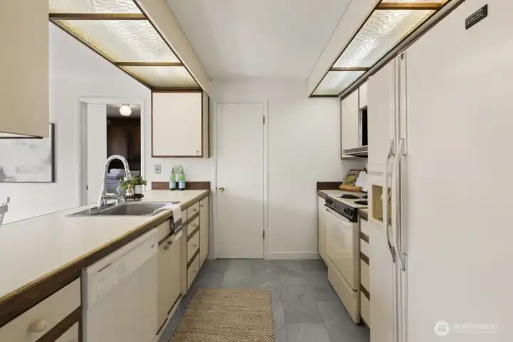 Clean kitchen in fresh modern tones blends right in.