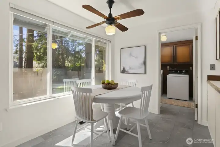 Kitching eating area flows into the utility room.