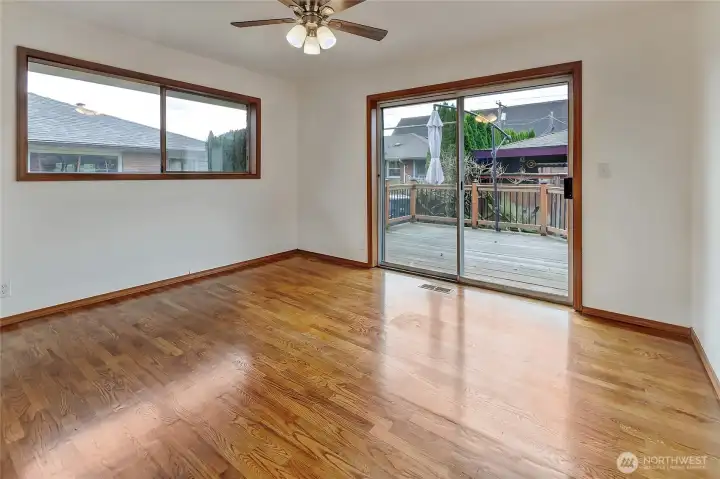Bedroom 2 entry looking out slider to deck.