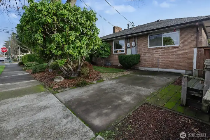 One bedroom driveway/parking area. Kitchen window in front.