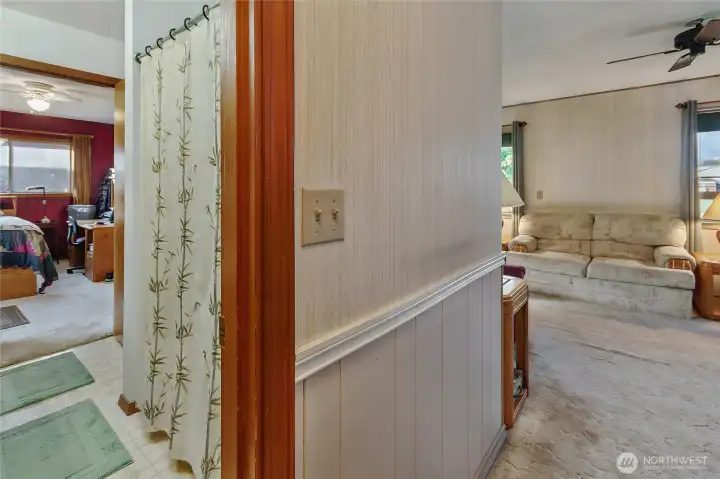 Entry to the right. Double doored bathroom looking into bedroom.