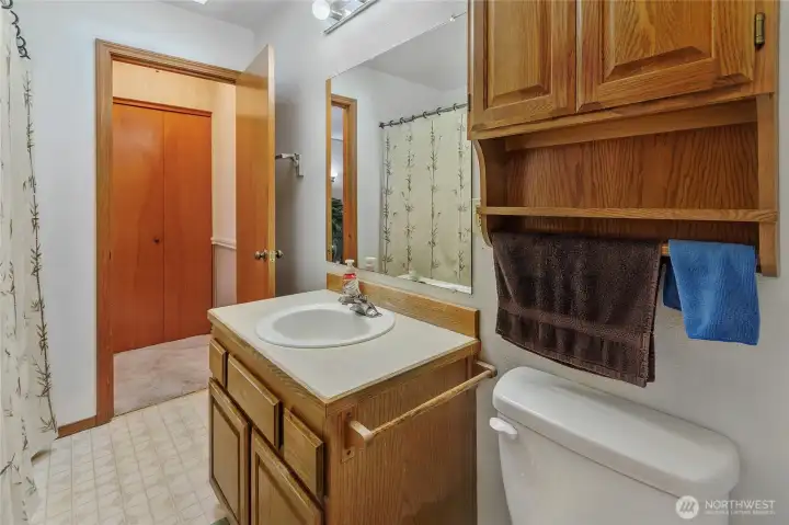 Looking from bedroom back to bathroom and washer/dryer closet.