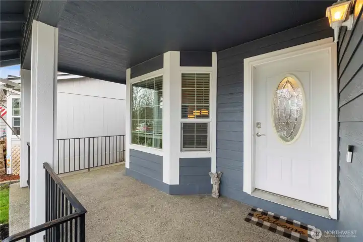 Covered porch has plenty of room for your patio chairs!