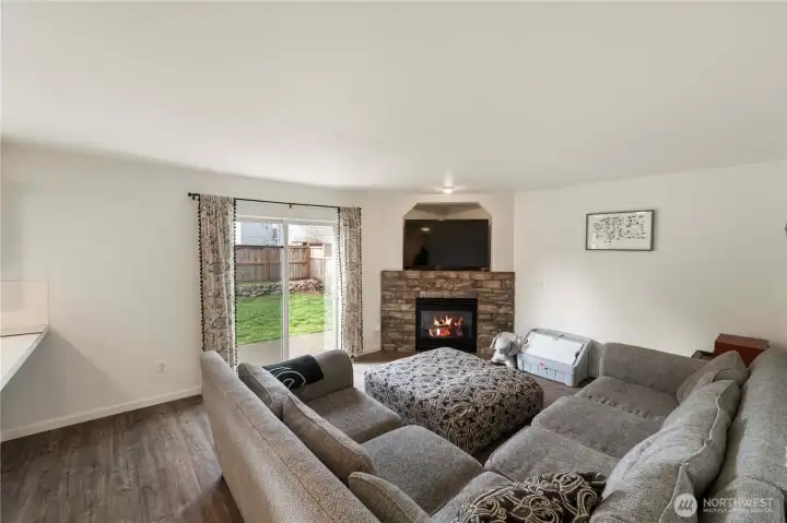 The cozy family room is adjacent to the kitchen.