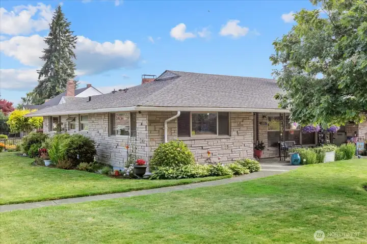 Classic stone exterior with mature landscaping in the desirable Clairmont neighborhood.