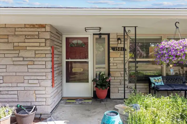 Welcoming covered front porch and inviting front entry.