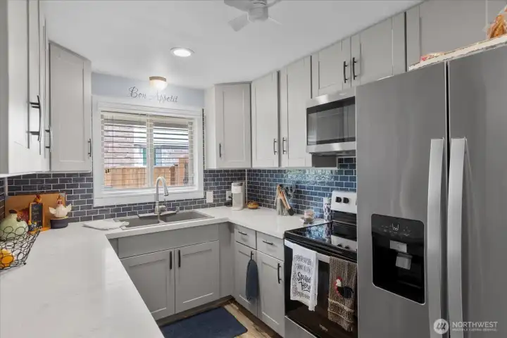 Thoughtfully updated kitchen with modern finishes and ample counter space for everyday cooking.