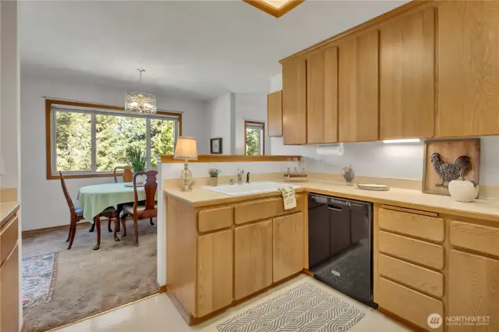 Kitchen is charming and has ample cabinetry