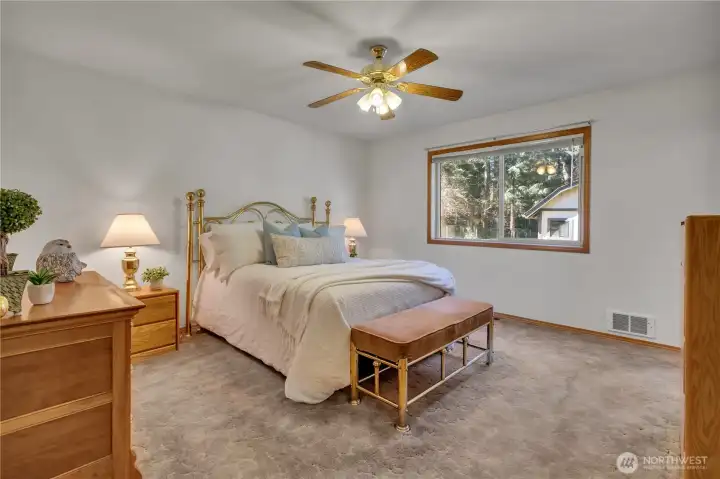 Primary EnSuite overlooks the beautiful backyard landscape