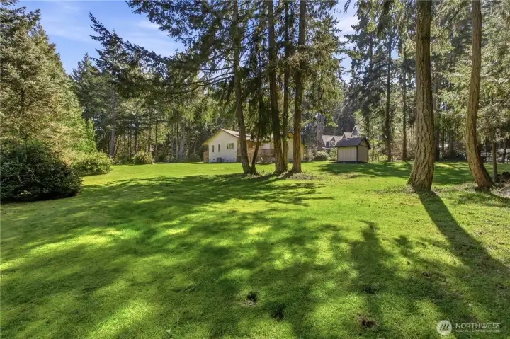 Amazing acreage level lawn spaces - room to roam!