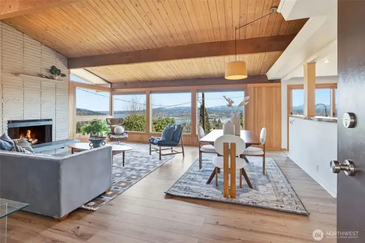 Welcome in! Wood clad vaulted ceiling, wood double paned windows and wood walls. The view!