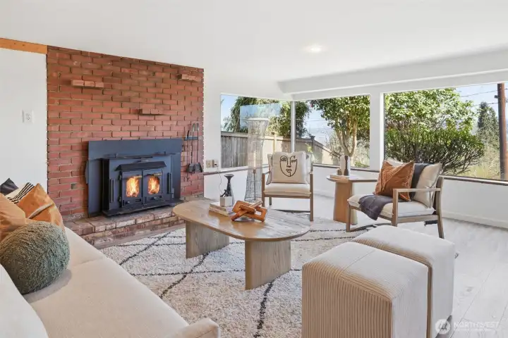 Lower level/ADU great room with original wood-burning fireplace.