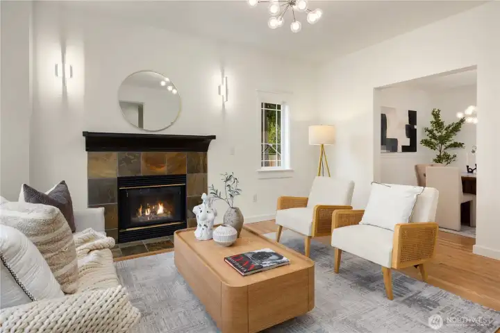 A gas fireplace anchors this room.  On the right you can see the dining room through the opening.