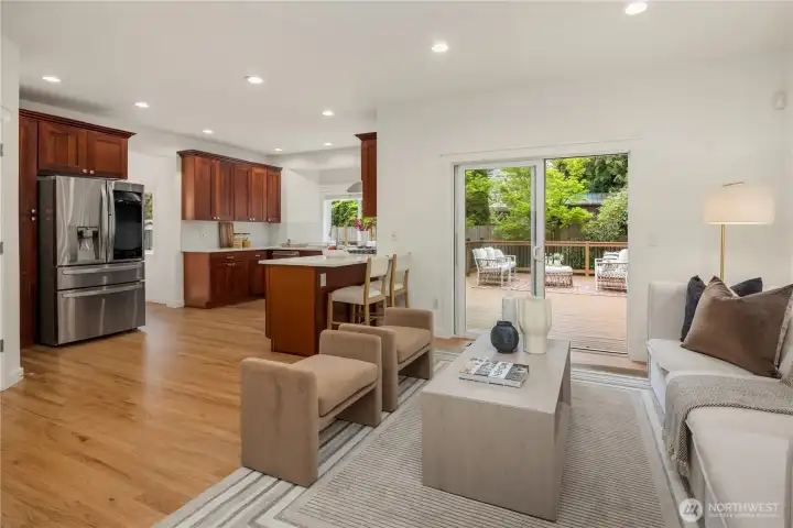 The kitchen/family room is the heart of this home...  A brand new stainless steel refrigerator is included!  Notice how the flow from inside to the outsode is so great.  Easy living!