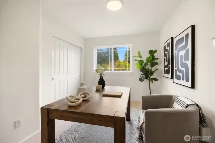 Second bedroom is staged as an office.