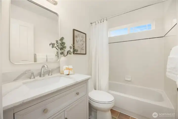 Full bathroom that the three bedrooms share.