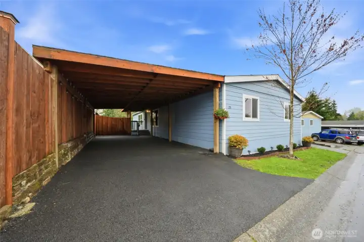 Covered carport providing sheltered parking.