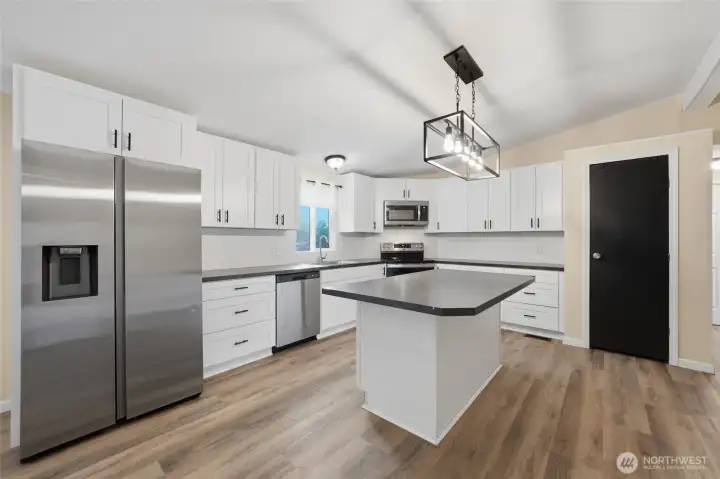 Functional kitchen with ample cabinetry and workspace.