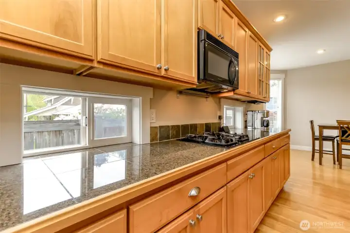 Oh my... this gorgeous kitchen is flooded with natural light and is just gorgeous. The cabinetry has been so well maintained!