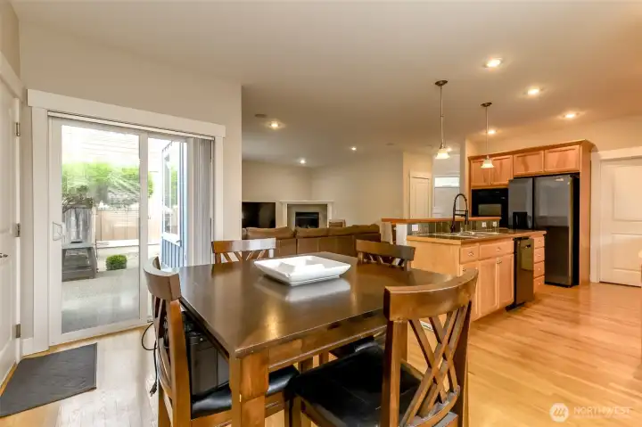 Sliding glass doors lead to the covered back porch and patio area.
