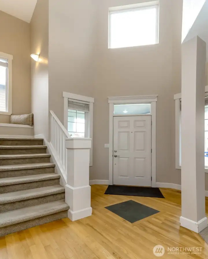 Gorgeous entrance with slate accent and vaulted ceilings and lots of windows.