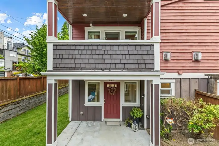 This corner unit checks a lot of boxes!  Fenced in outdoor space for dining area, planting or dog run.  This is a premium for city living!  Green grass is edited in.