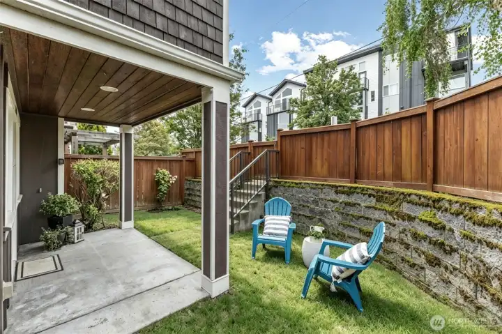 Covered entry patio plus an L-shaped fenced in area - make this your outdoor oasis!