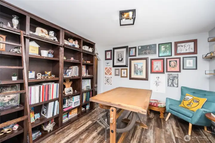 Traditionally this space is the formal separate dining room, the owner has utilized it as her tranquil art room and library, complete with a sliding ladder. If you dont need a formal dining room, consider it ANOTHER bonus room!! Traditionally this space is the formal separate dining room, the owner has utilized it as her tranquil art room and library, complete with a sliding ladder. If you dont need a formal dining room, consider it ANOTHER bonus room!!