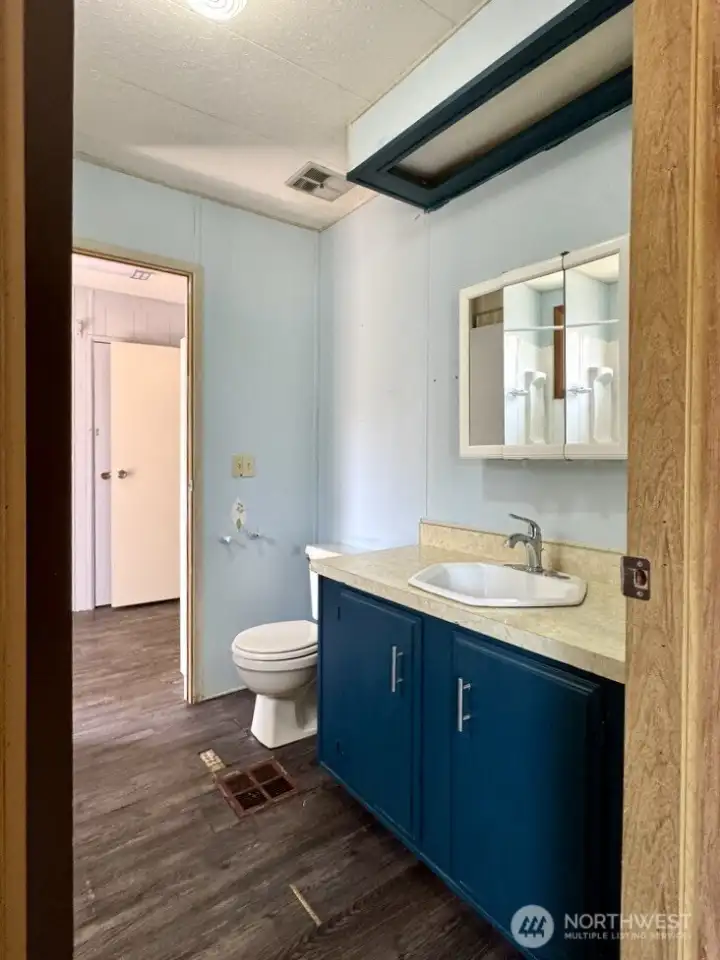 Jack and Jill bath connects the spare room to the back entry. Jack and Jill bath connects the spare room to the back entry.