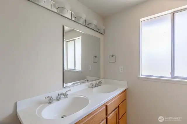 Primary bath with dual sink vanity.