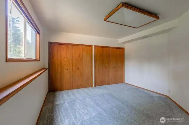 Lower level bedroom with double closets.
